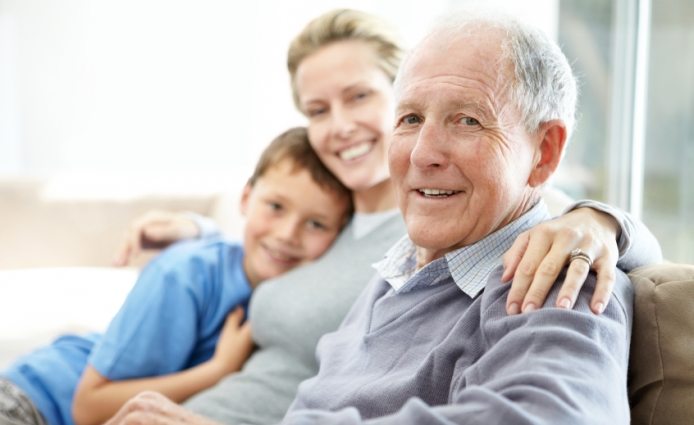 Senior man sitting with his daughter and grandson