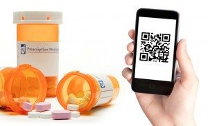 Prescription Pill Bottles with Pills and Smartphone with QR Code